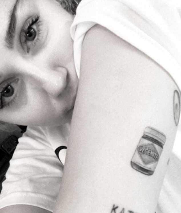 3622E54500000578-3683441-Is_she_a_fan_Miley_Cyrus_new_inking_of_a_jar_of_Vegemite_was_rev-m-112_1468172232679